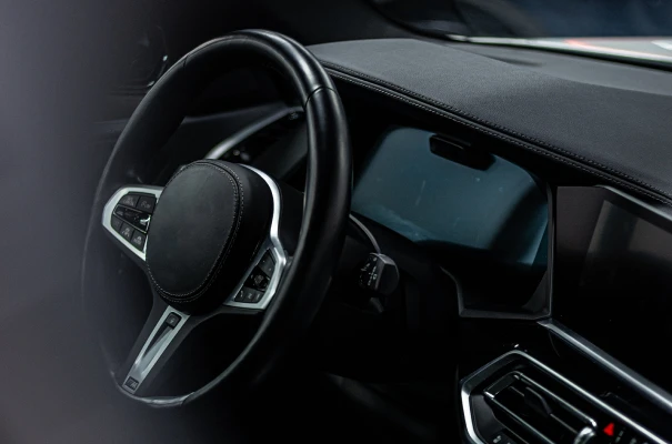 Car interior showing steering wheel