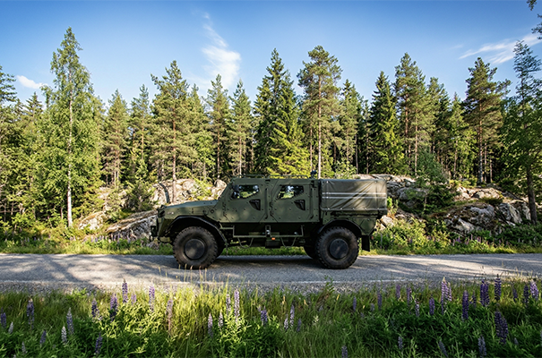 Armored vehicle standing on a road in the forest