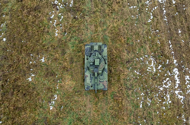 A tank in the middle of a field